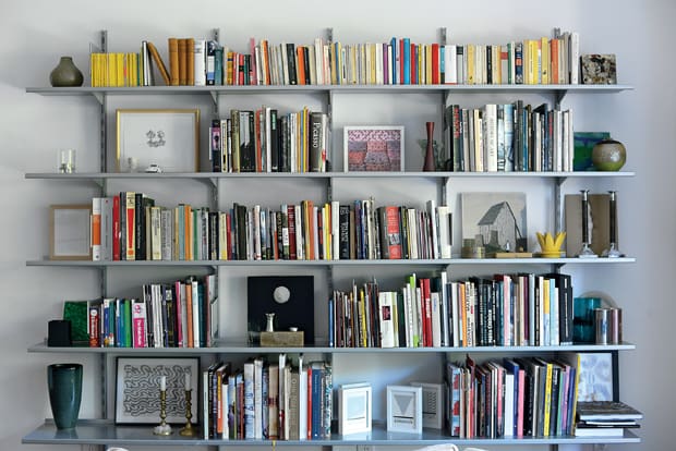 Bookshelves brim with art volumes and exhibition catalogs mostly used when Hettig wrote for illustrious art journals like Artforum and Kunstforum in the 1990s.