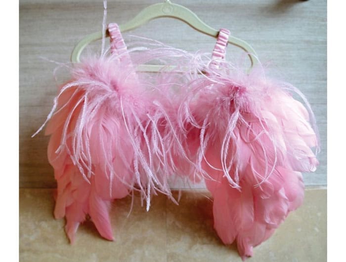 A sweet pair of angel wings hangs near her boudoir.