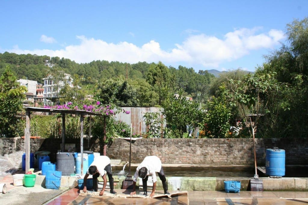 Carpet washing in Nepal. After weaving all of the carpets are washed by hand and then laid flat to dry in the sun. At this elevation the air is so clean and the light so intense that all of the colors are amazing.
