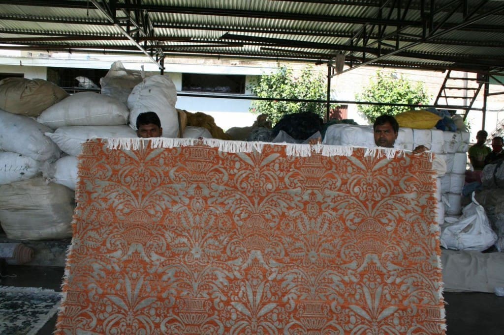 A carpet designed for Carol Piper Rugs- just finished drying and in the process of being finished with hand scissoring.