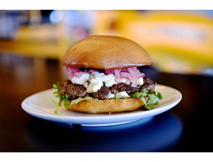 The Mascot at Bernie's Burger Bus. Bison burger topped with goat cheese, baby arugula, pickled red onions and a chipotle blackberry BBQ sauce. Photo courtesy Kimberly Park. 