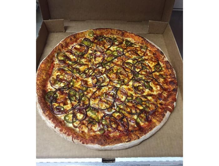 Southwestern pizza pie at Pink's Pizza. BBQ marinated chicken breast, red onions, jalapeños, mozzarella and cheddar cheese. 