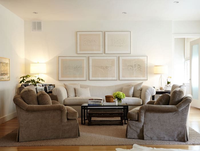 In the main living area is a collection of artworks belonging to John Bitzer by Paris-born, Taos-based cubist artist Andrew Dasburg, who was a contemporary of Gertrude Stein and Georgia O’Keeffe.  At left, an early lithograph by Joan Miró that Mary Ella purchased in the 1960s in New York City. The sofa and chairs are from Baker, and the sofa is recovered in Peacock Alley linen fabric. 