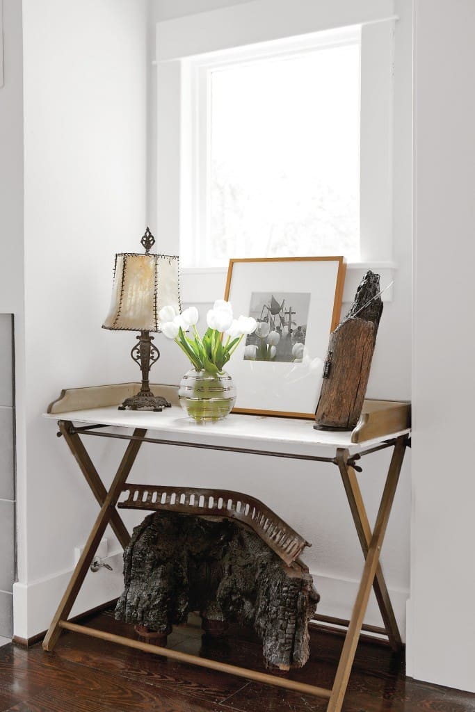 In one nook in the living room, a wood-and-marble table grounds a beautiful vignette. Vintage print by Trudi Blom, gifted to Cusack by her mom, Barbara Hill; the image records people of the vanishing Lacandon Rain Forest, Chiapas. Underneath, one of Cusack’s sculptures features charred wood from her “Campfire Stories,” exhibited at Koelsch Gallery, 2009.