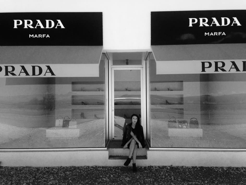 Liz taking a break at Prada Marfa, the only source of shade for miles