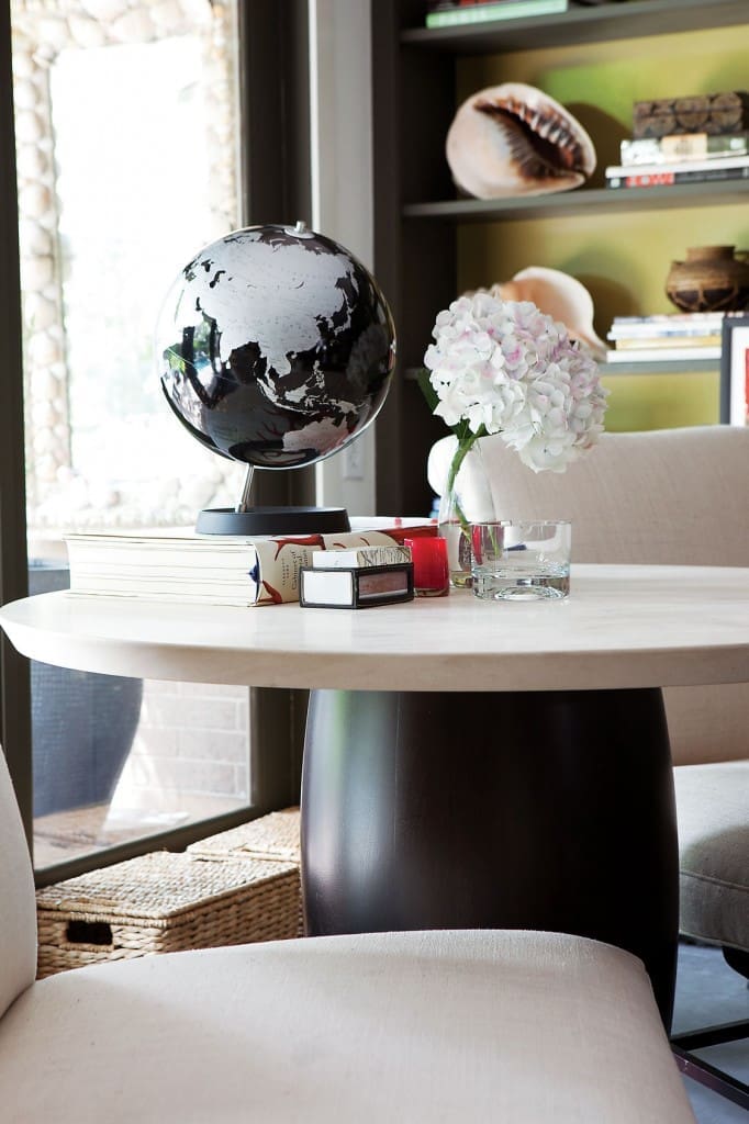 Holly Hunt limestone-and-ebonized-wood-base cocktail table.