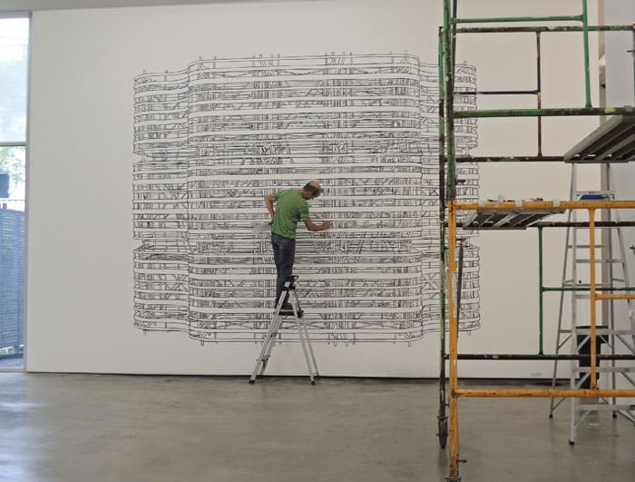 Pablo Siquier installing his 2013 exhibition "Structure" at Sicardi’s current West Alabama gallery.