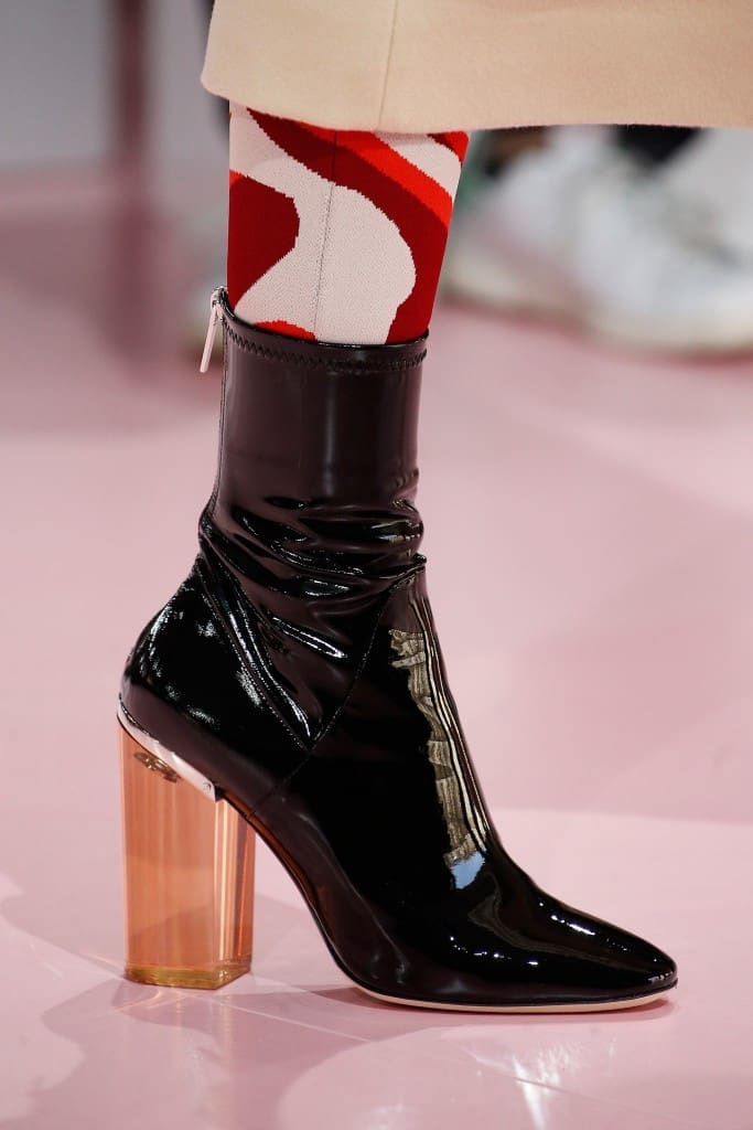 Glossy black latex legging boots on the Dior Autumn/Winter 2015-2016 runway.