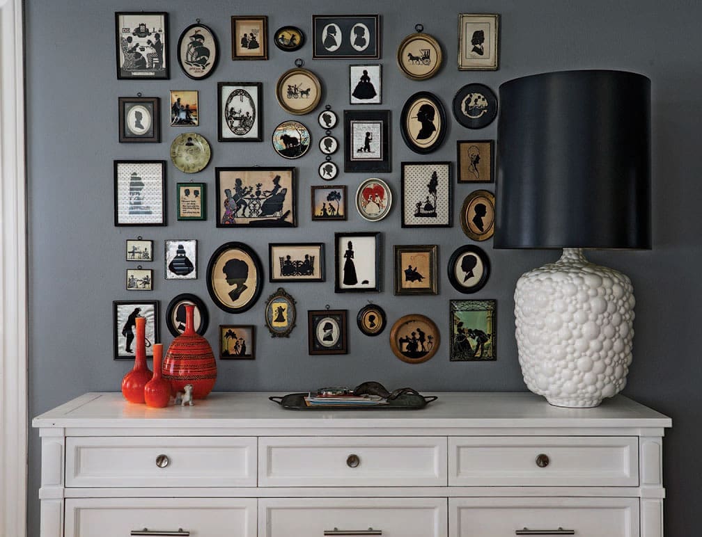 A showcase of silhouettes collected for years by Brian Sensabaugh. Vintage lamp from Metro Retro Furniture, with a ’70s shade from Nicoletti’s. Vintage credenza from Anthropologie. Vintage orange Royal Haeger pottery, circa 1919.