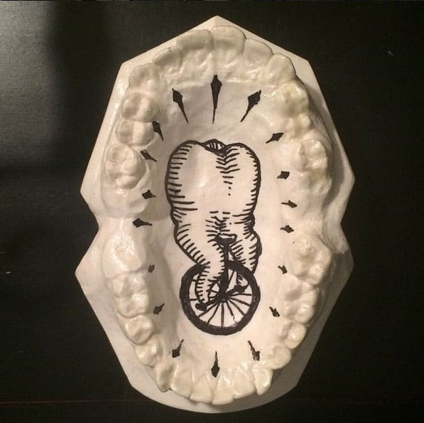 Jesus A. Castaneda (@exoskeletal27) is presenting his first solo exhibition, Extracted Manifestations, at the Division 9 Gallery in Riverside, California. His work is often composed of paintings or statues that depict teeth, evoking the human condition.
