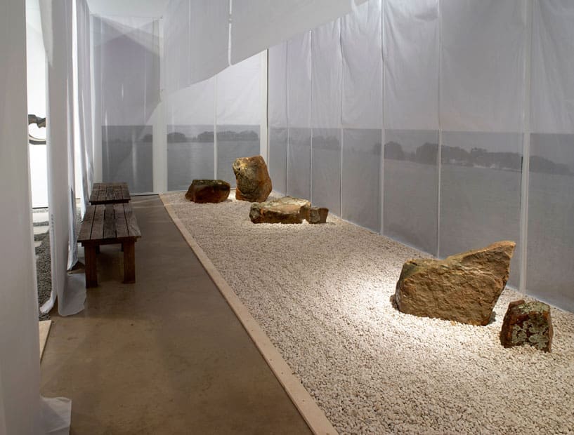 The only movement implied in "I Am Content" is the trail of an implement used to rake the rock garden.