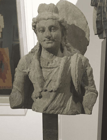 A 4th-century Buddha inspired by Apollo, in Muzeion's booth. (Photo by Nancy Gutierrez.)