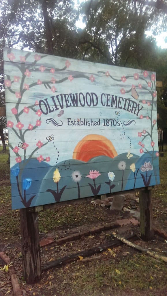 A welcome sign at Olivewood Cemetery, as restored by YES Prep Southeast students class of 2013. (Photo by Matthew Ramirez)