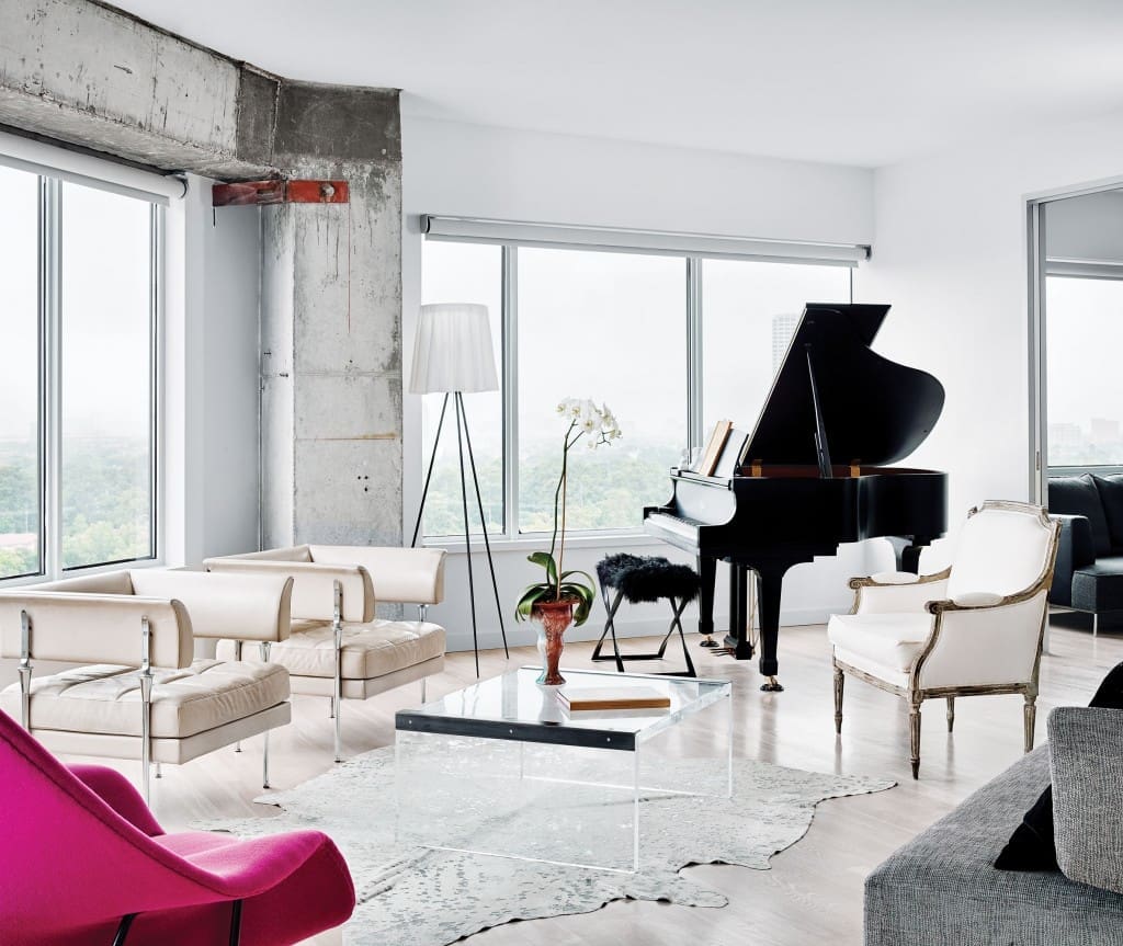 In the living area, pair of vintage Italian leather chairs and French gold-leaf bergère, all from Watkins Culver. Vintage Plexiglas and steel coffee table from Found. Philippe Starck Rosy Angelis floor lamp for Flos. Silvered cowhide rug and furry piano stool, both from Vieux.