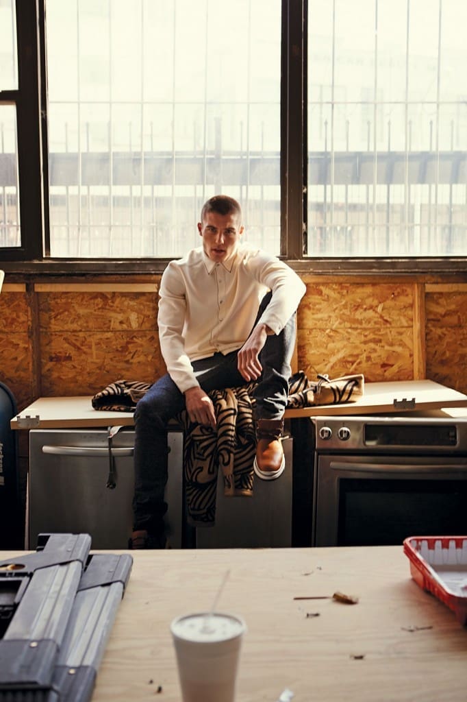Louis Vuitton jersey shirt $1,370, needlepoint jean $1,170, Swirl Dirby lace-up boot $1,140, and blanket duffle coat $6,750, all at the Louis Vuitton boutique.
