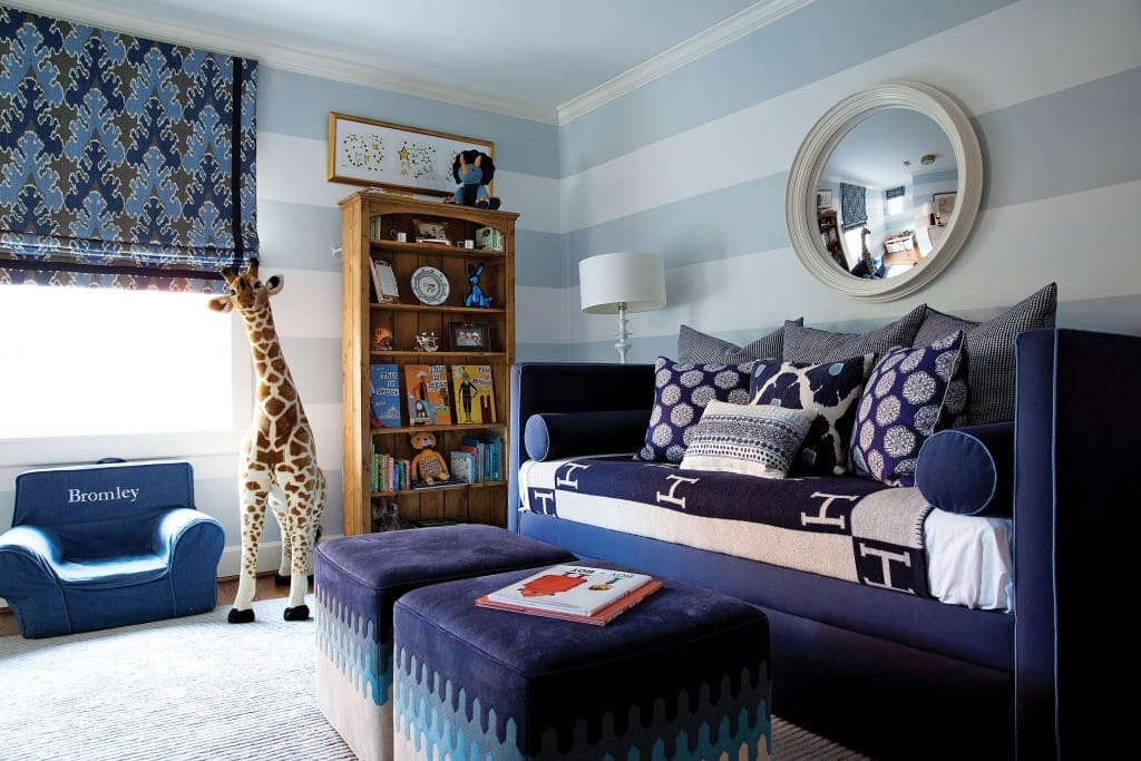 Looke made the most out of an awkward layout by embracing pattern in blue and white in her son’s room. Custom daybed is by The Joseph Company, upholstered in a Lee Jofa fabric with Samuel and Sons trim; John Robshaw pillows and Hermès Avalon blanket. A fluffy duvet hides out in the closet for sleeping. 