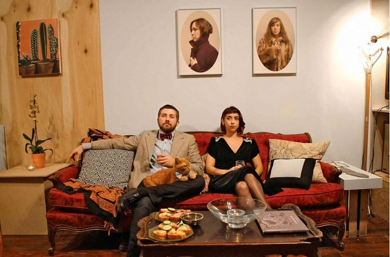 Salon style: Paul Middendorf and Olivia Abbott with Ike the feline in Middendorf's home adjoining GalleryHomeland, among Houston's most intriguing new arts venues. (Photo Marc Newsome)