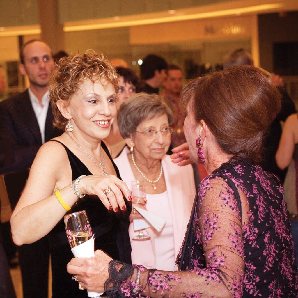“I am drenched in Cathy Waterman with my proud mother,” says Joanne. “My hair was post-chemo, and I was happy to have it!”
