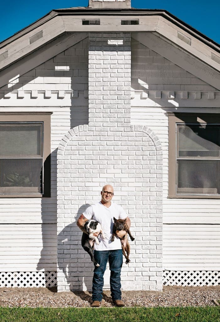 Seth Siegel-Gardner with dogs Catfish and BBQ, outside their Arts-and-Crafts bungalow.