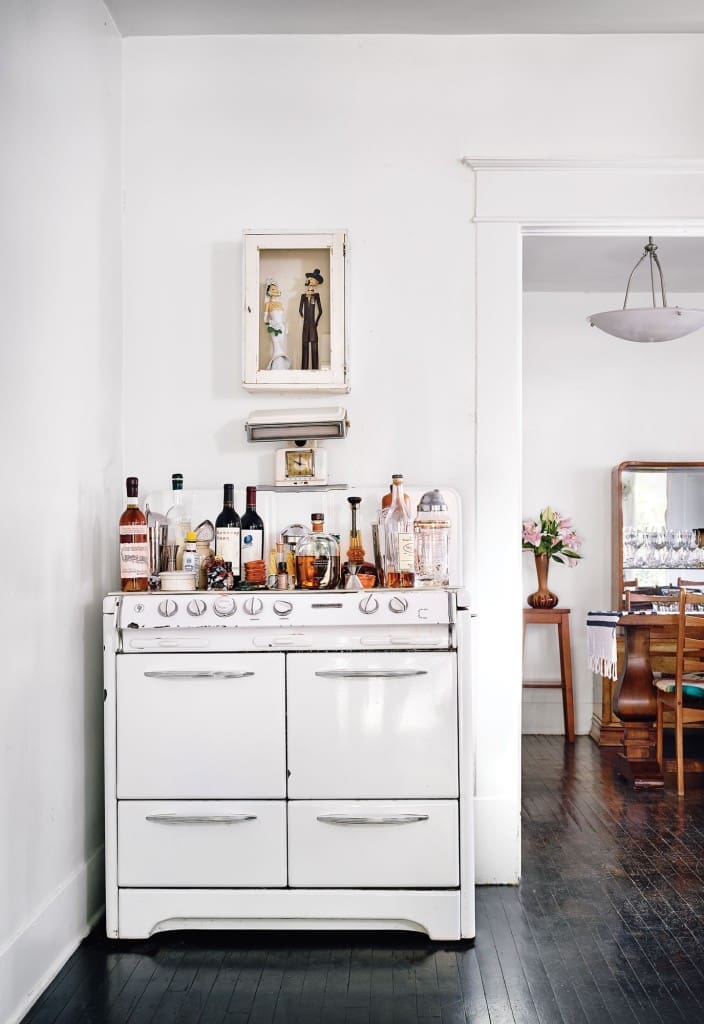 A 1950s stove in the kitchen acts as a bar; the drawers house spirits by type.