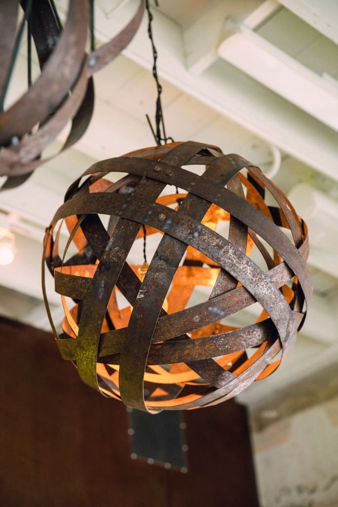 Craftsman Steve Walters formed these pendant chandeliers from metal barrel stays.