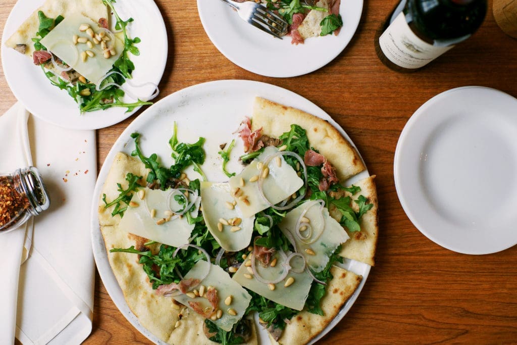 Grab a woodstone oven foccacia at Taverna this April. (Courtesy photo)