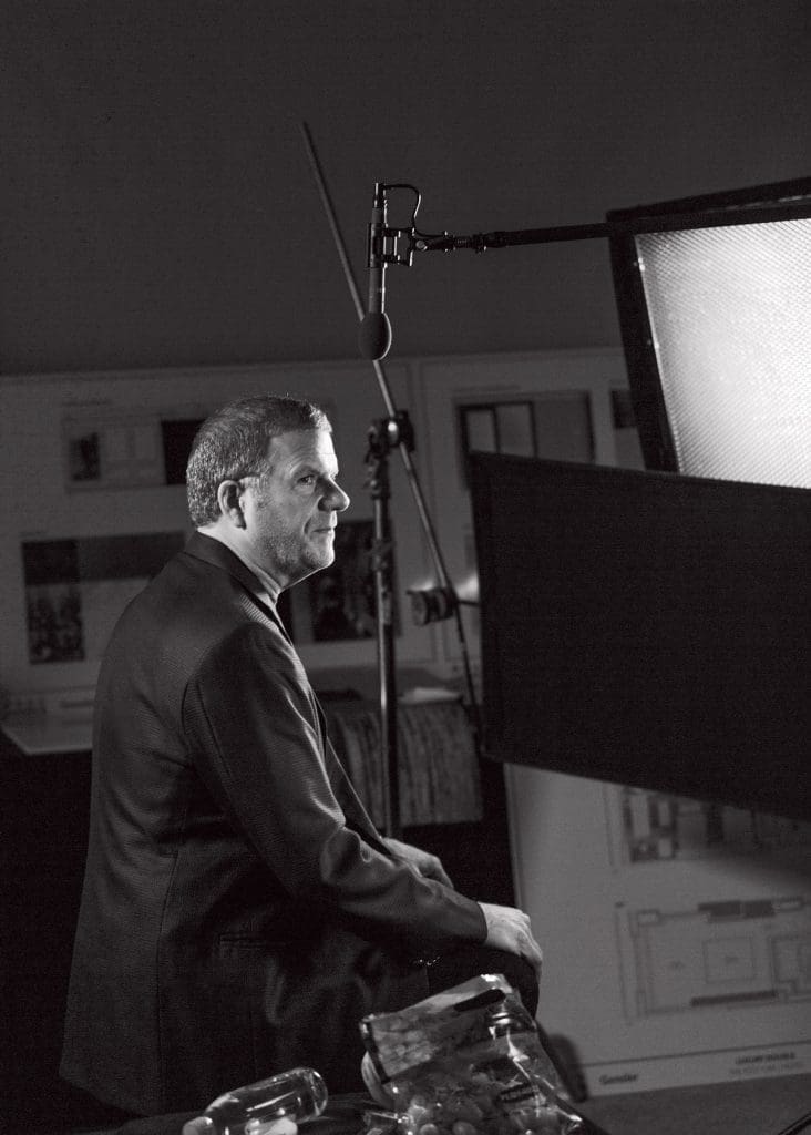 Tilman Feritta does touch-ups for his new TV show. (Photo by Max Burkhalter)