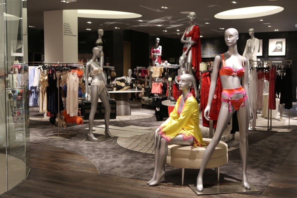 Saks' completely revamped lingerie department features stained oak by DHF, custom carpets from Turkey-based Stepevi and wallcoverings by Alpha Workshop. (Photo by Priscilla Dickson)