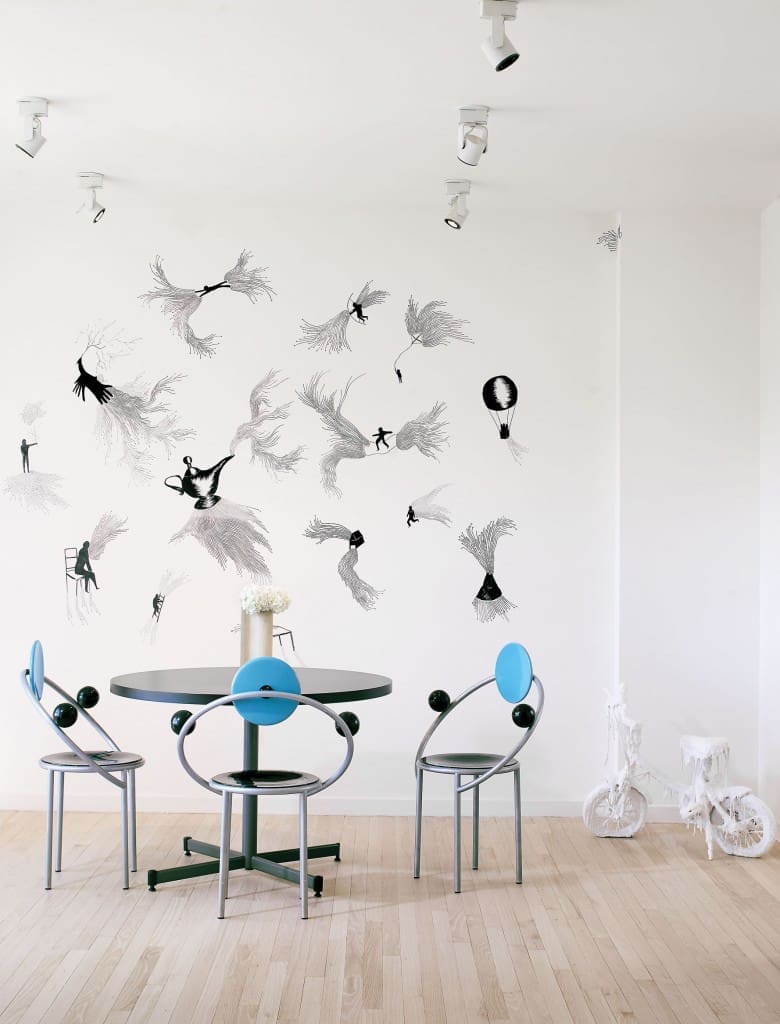 Michele De Lucchi’s Memphis table and chairs from the Memphis Milano Collection, 1983. On the wall, Andrea Bianconi’s "Aladdin’s Lamp," 2015, a site-specific drawing inspired by the fable of "Aladdin and the Wonderful Lamp." Right: Bianconi’s "Where?," 2013, a child’s bicycle encased in glue and white-enamel paint. Foreground: a sculpture by Allan Hacklin, circa 1980s. The artist played a pivotal role in Houston art history: He founded the Core Program at the Museum of Fine Arts, Houston’s Glassell School of Art.