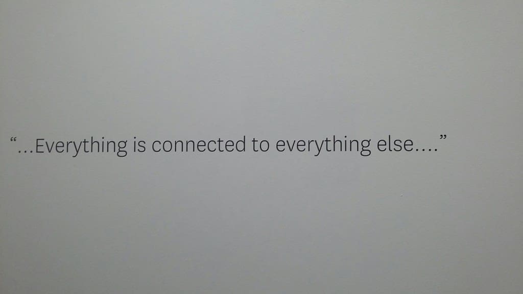 At Spring Street Studios, a FotoFest sign bears a significant message. (Photo CDA)