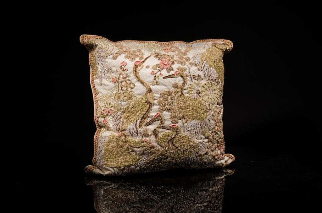 Heavily encrusted, hand-beaded with Czech glass beads stork motif tapestry; border trim detail, metallic, platinum silk welt; pale pink cashmere back with triple vintage French ribbon detail, $3,750