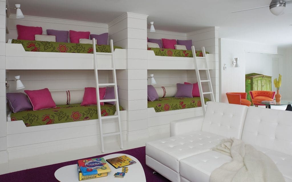 The bunk room’s custom beds are covered in Designers Guild fabrics.