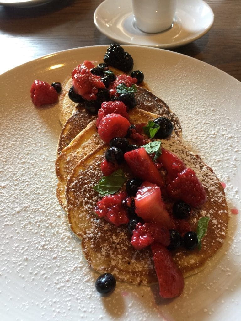 Pancake made with ricotta are moist; pour some syrup on them.