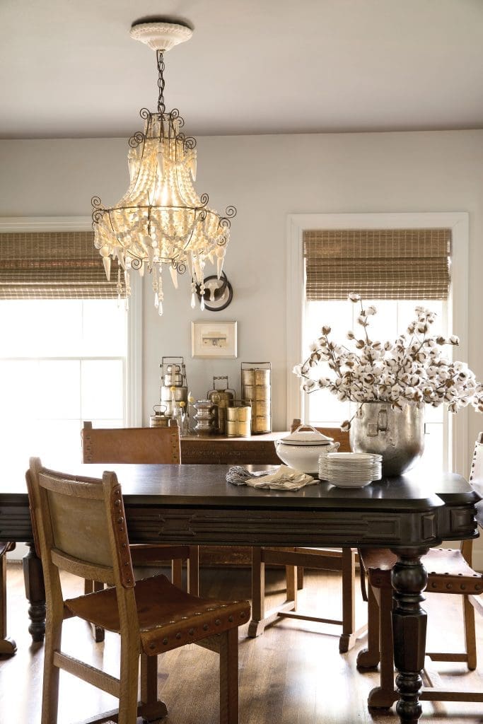 In the dining room, a collection of tiffin containers (Indian lunch boxes) sets the tone. Custom dining table manufactured by Barton’s factory in India, modeled after a 15-foot-long antique. Vintage leather chairs
found at Urban Market. Clay chandelier by Mud Studio.