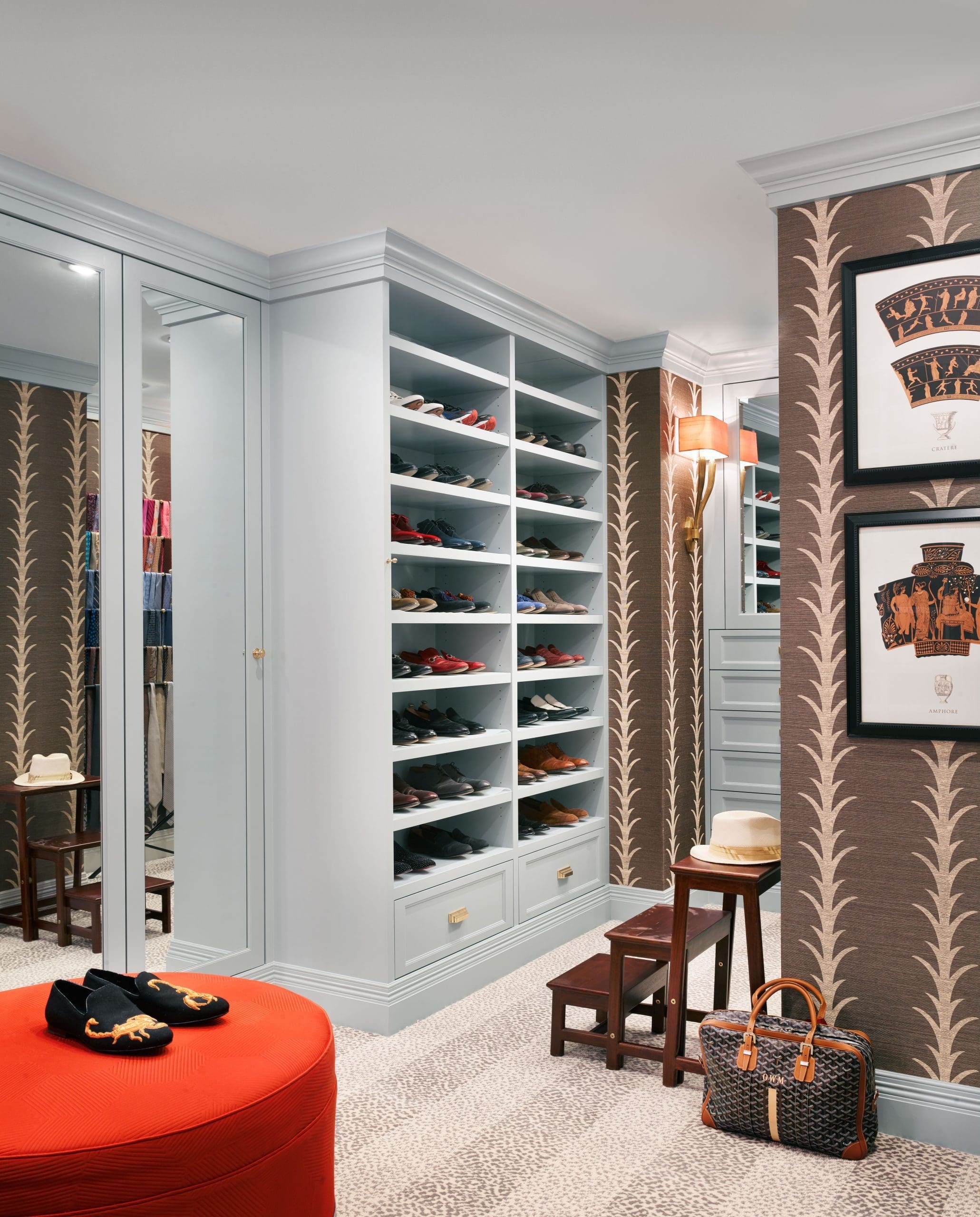 The distinctive closet at Villa d'Este features a custom ottoman in Rubelli fabric and fashion designer Michael Vollbracht's 'The Discus Thrower' gouaches, undated. 