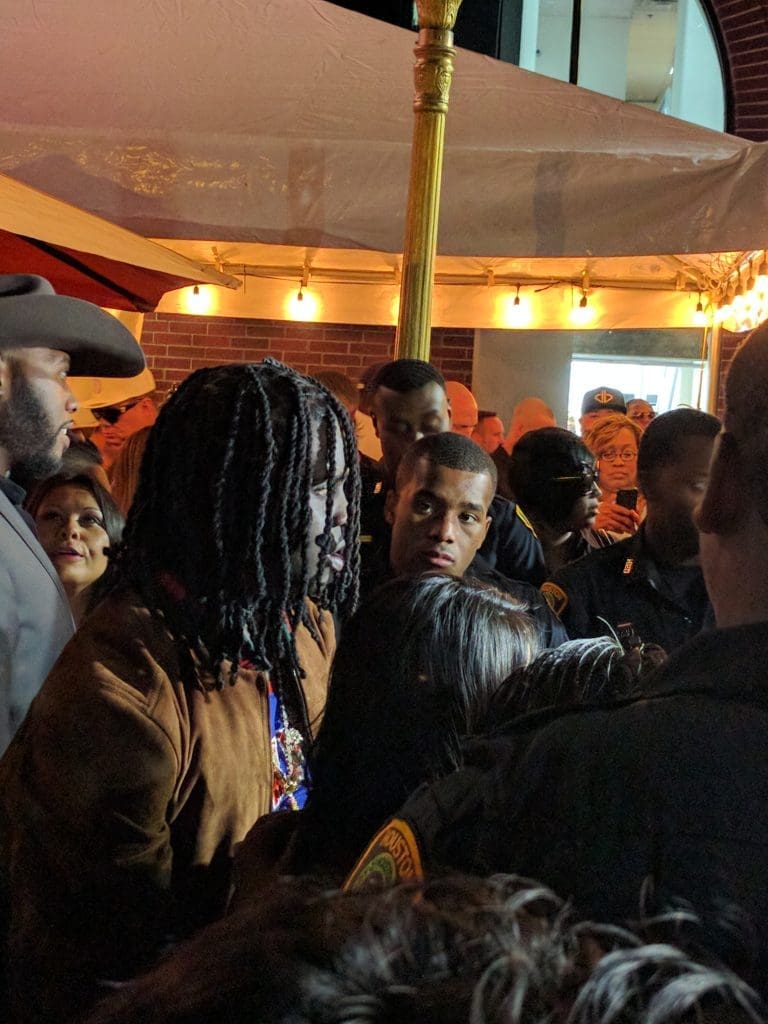 The crowd intensified and put their cameras up for a rare chance to see Chicago rapper Chief Keef up close and personal, here posing at the Hennessy station.