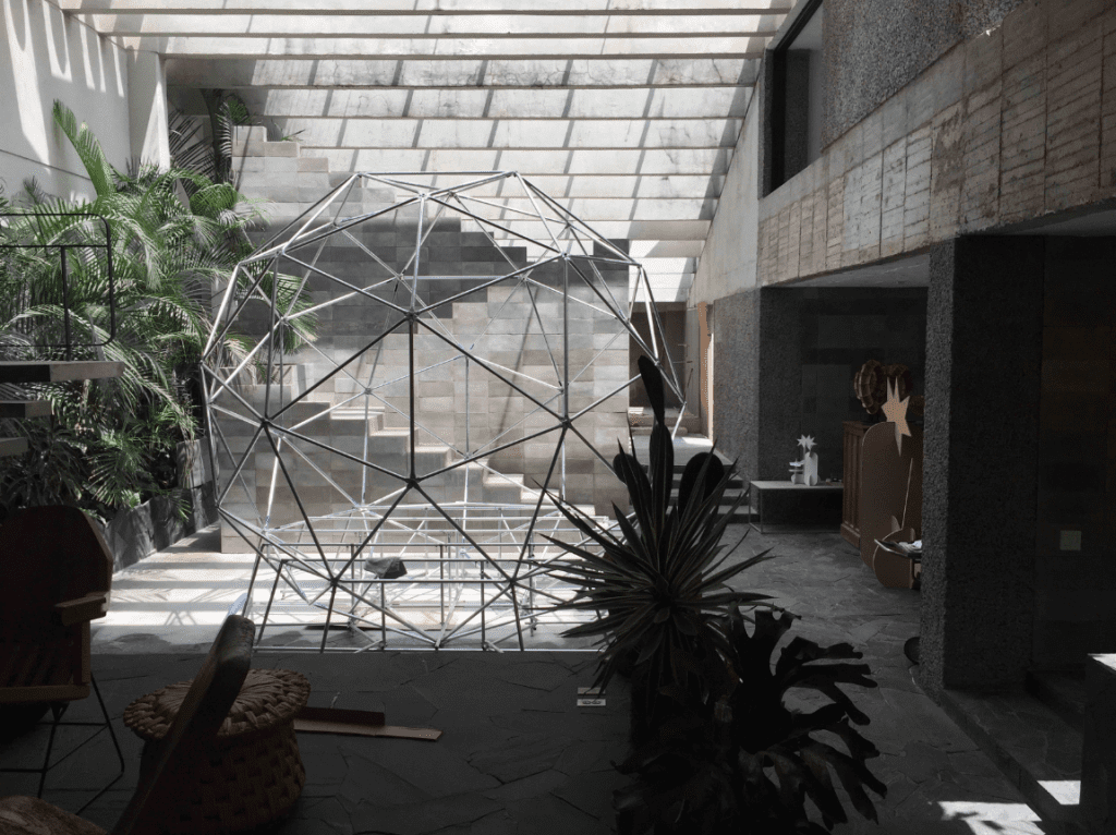 Sculptural works in the brutalist living space at their home