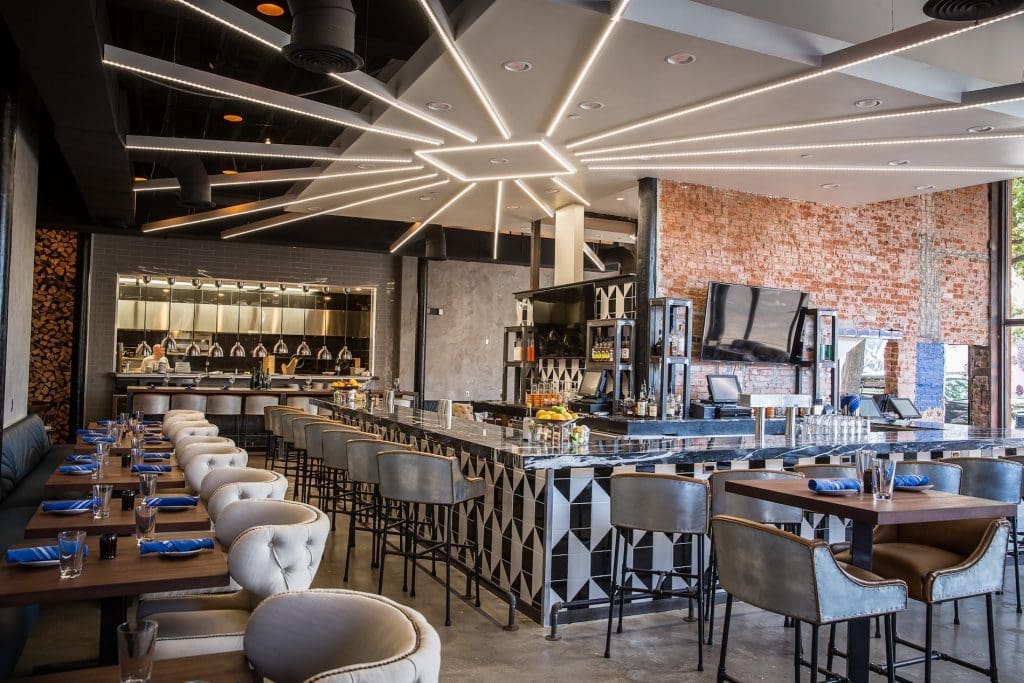 The restaurant features exposed brick walls and polished concrete floors.