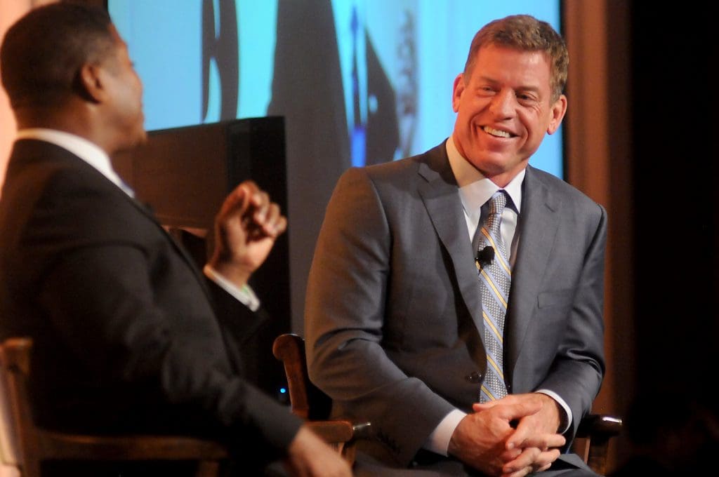 Emcee Spencer Tillman speaks with special guest Troy Aikman at the Touchdown for Teach event at the River Oaks Country Club Tuesday Nov. 15, 2016.(Dave Rossman photo)