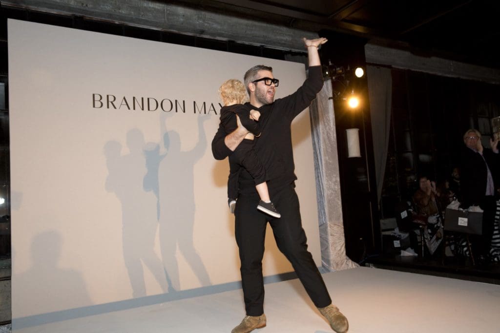 Fashion designer Brandon Maxwell with his nephew at Houston's Catwalk for a Cure fundraiser. 