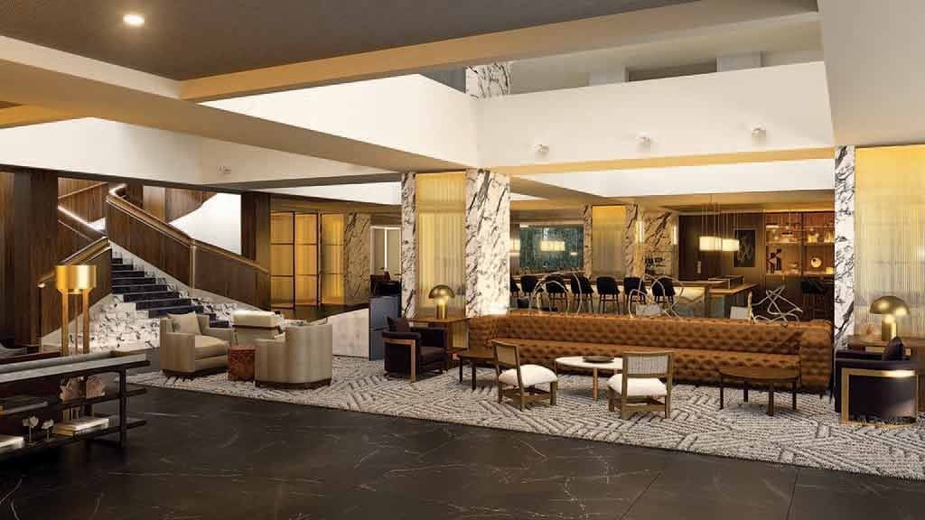 The Four Seasons' new lobby features bold marble and gold accents alongside custom made leather couches. 