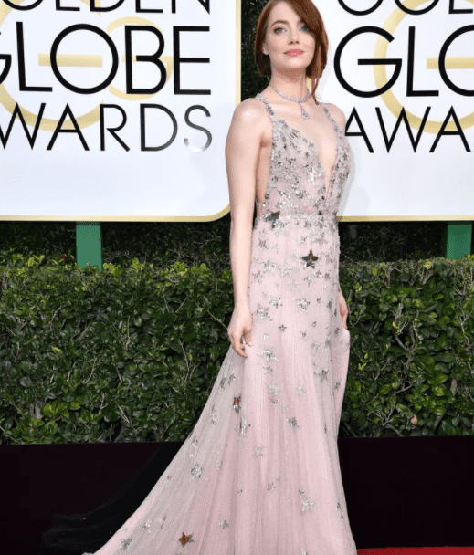 Emma Stone, in Valentino, is skyrocketing to this year's podium to claim all that's hers. 