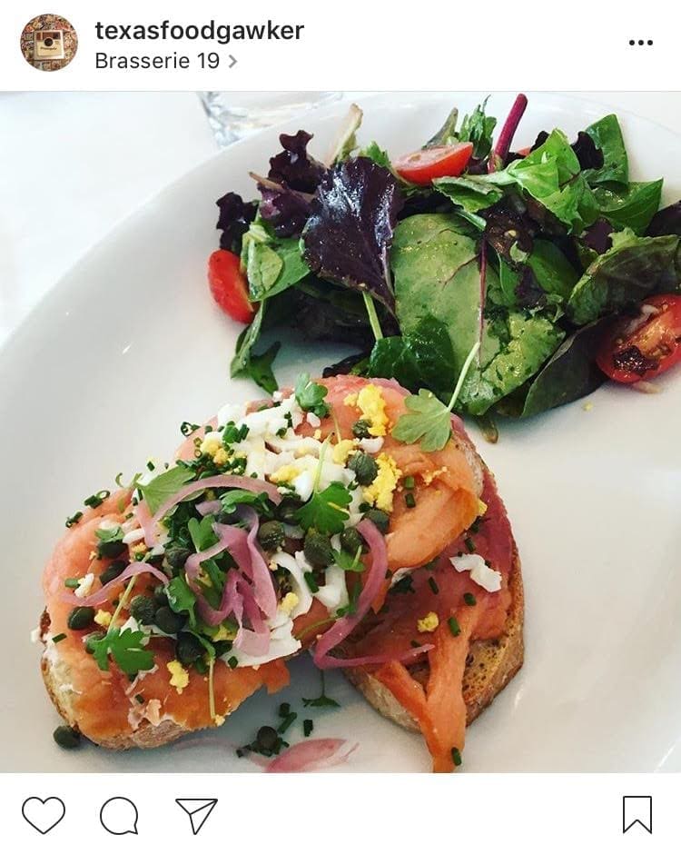 Smoked salmon tartine with pickled red onion, capers, chopped egg, goat cheese and a side salad from Brasserie 19