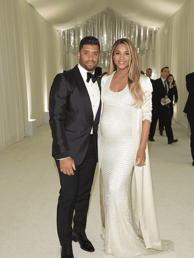 Ciara in an August Getty Atelier knit gown with husband Russell Wilson 