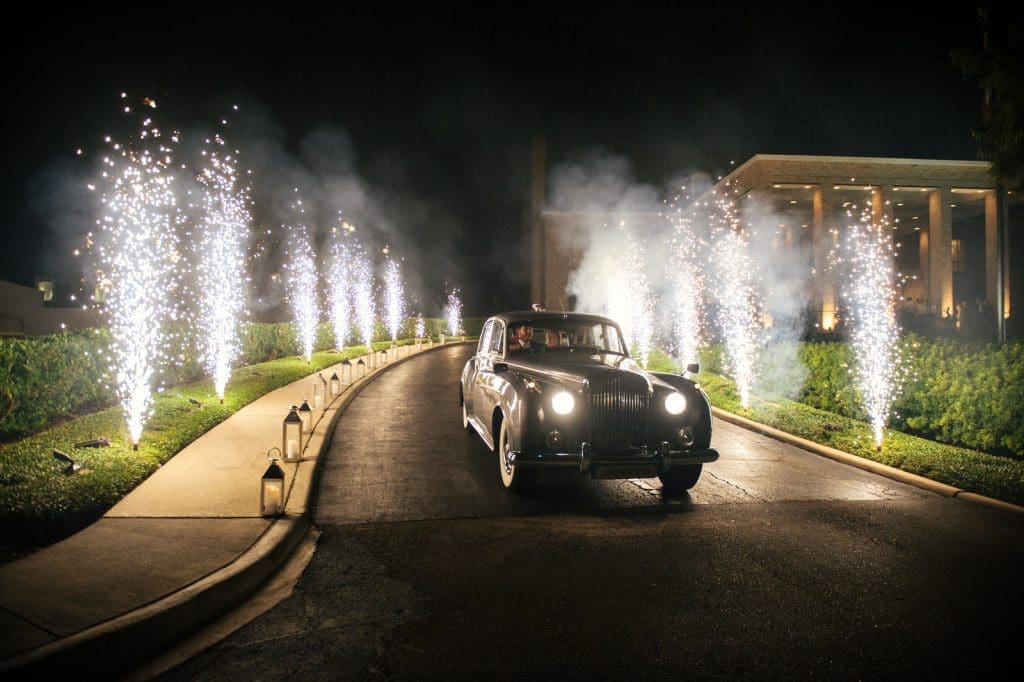 A Rolls-Royce Silver Cloud shuttled the couple from the reception. 