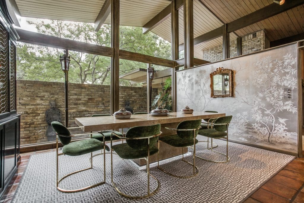 In the dining room, vintage mid-century chairs by Design Institute of America, and Milo Baughman table, all from Scout Design Studio. Early 20th-century Spode tureens. Gracie wallpaper. Stark rug.