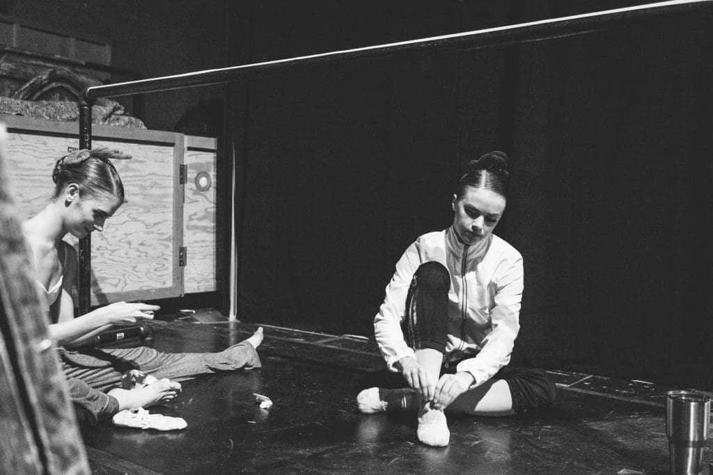 Kuhns slips on her ballet shoes before taking the stage.