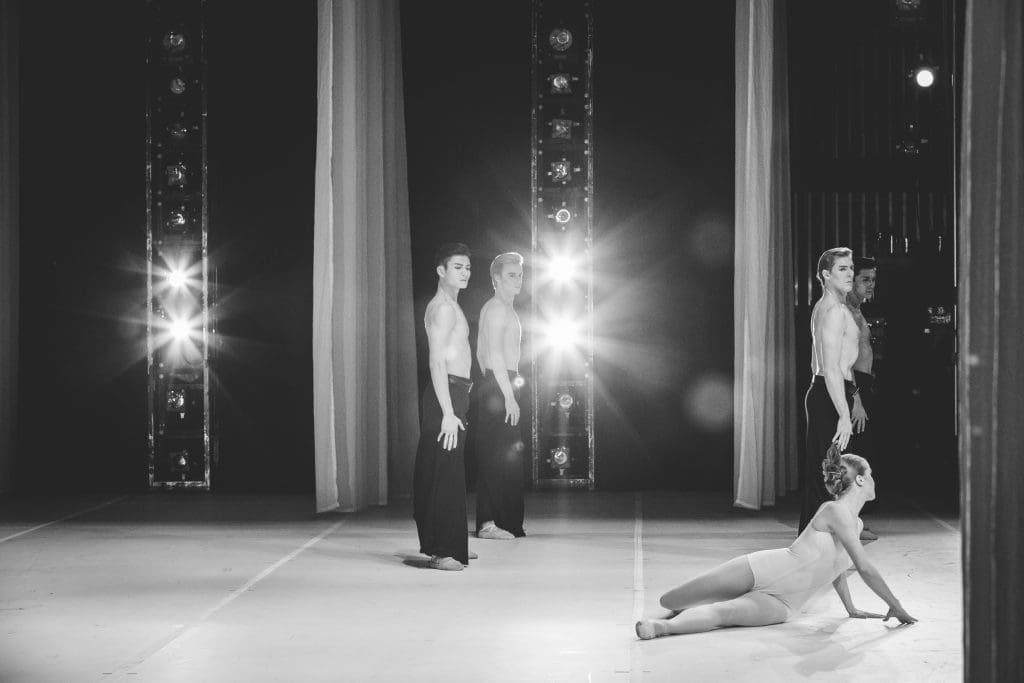 Kuhns performs onstage with her fellow cast members. 