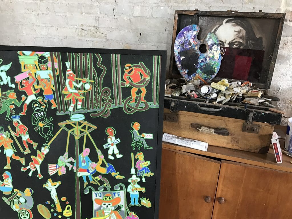 Studio montage: Mark Clark paints Aztecs, gangs, cultural icons, and complex patterns.