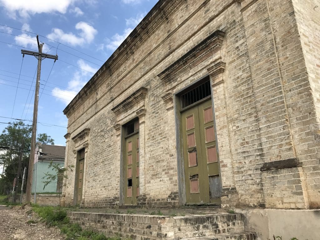 19th-century commercial architecture in Roma, Texas. The doors of the Jose Nestor Saenz Store are flanked by Doric pilasters, the work of German master builder Heinrich Portscheller.